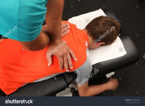 stock-photo-a-chiropractor-treating-a-young-boy-222584548   